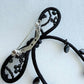 Back view of the black ribbon brooch showing the brass pin